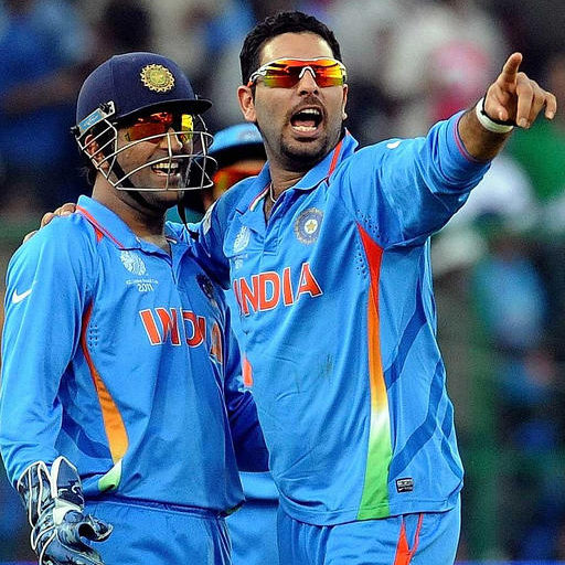 Indian cricketer Yuvraj Singh (R) celebrates with captain Mahendra Singh Dhoni after his fifth wicket of unseen Ireland batsman Alexander Cusack during The Cricket World Cup match between India and Ireland at The M. Chinnaswamy Stadium in Bangalore on March 6, 2011. Ireland continues to bat at a score of  207 runs for the loss of nine wickets after 47 of their allotted 50 overs after India won the toss and elected to field first. AFP PHOTO/Prakash SINGH (Photo credit should read PRAKASH SINGH/AFP/Getty Images)